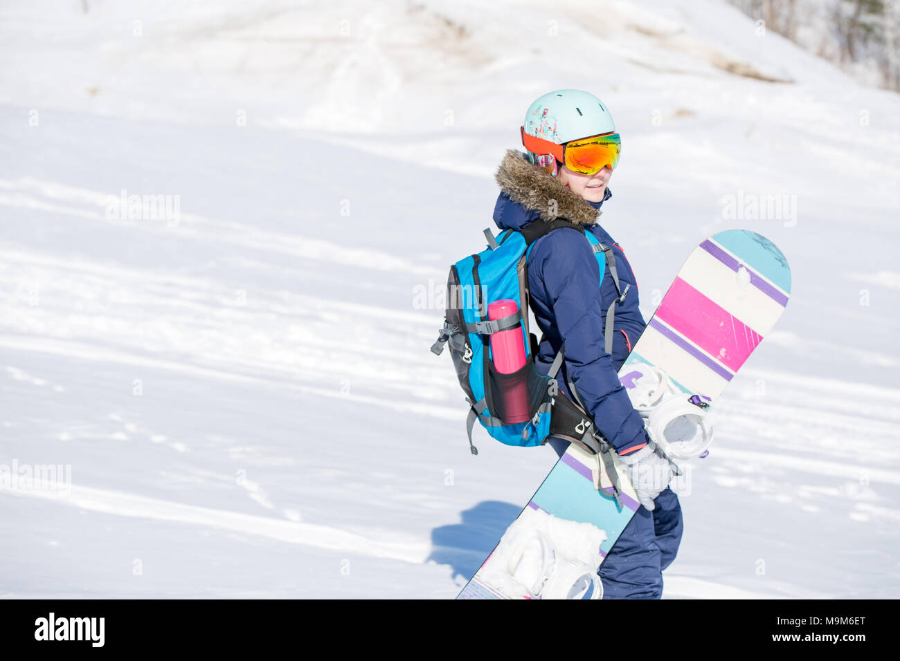 Image of female athlete wearing helmet with backpack and snowboard Stock  Photo - Alamy