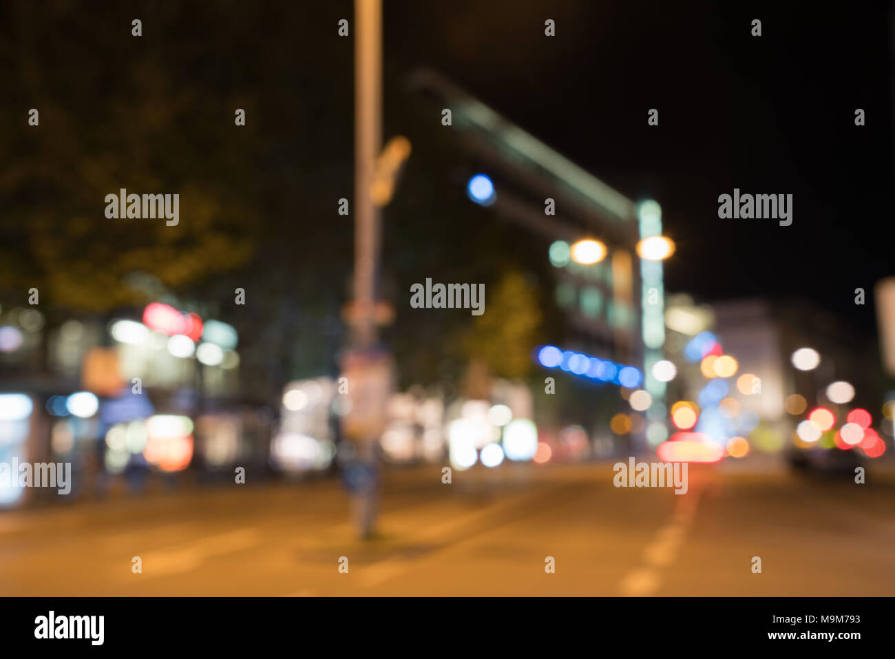 Blurry background effect of city street at night with defocused car ...