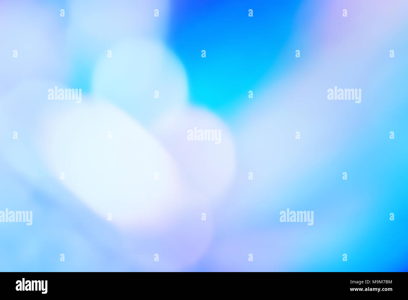 Abstract gradiant wallpaper holographic foil with blurred bokeh light effect. Blur holographic neon foil background. Stock Photo