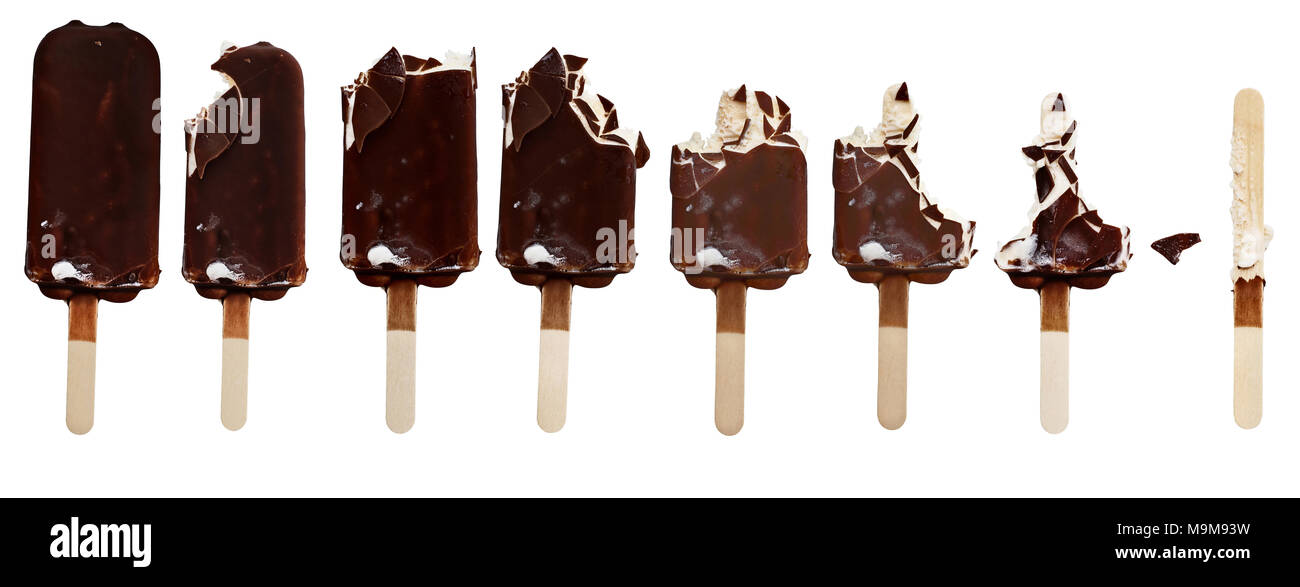 Progression of chocolate covered vanilla ice cream bars on a wooden stick with bites taken out. Isolated over a white background. Stock Photo