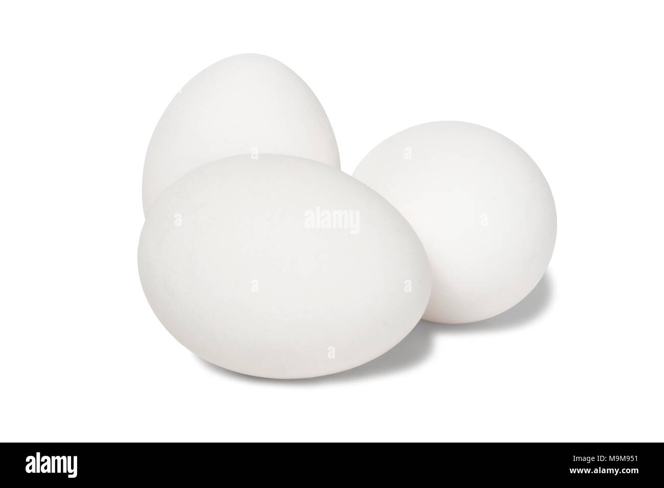 Three white eggs isolated on white background Stock Photo - Alamy