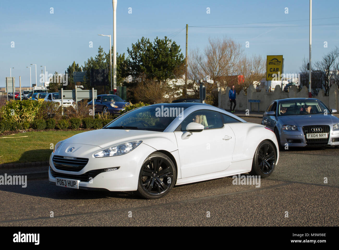 Peugeot RCZ GT THP Auto; North-West Supercar event as cars and tourists arrive in the coastal resort. SuperCars are bumper to bumper on the seafront esplanade as classic & vintage car enthusiasts enjoy a motoring day out. Stock Photo