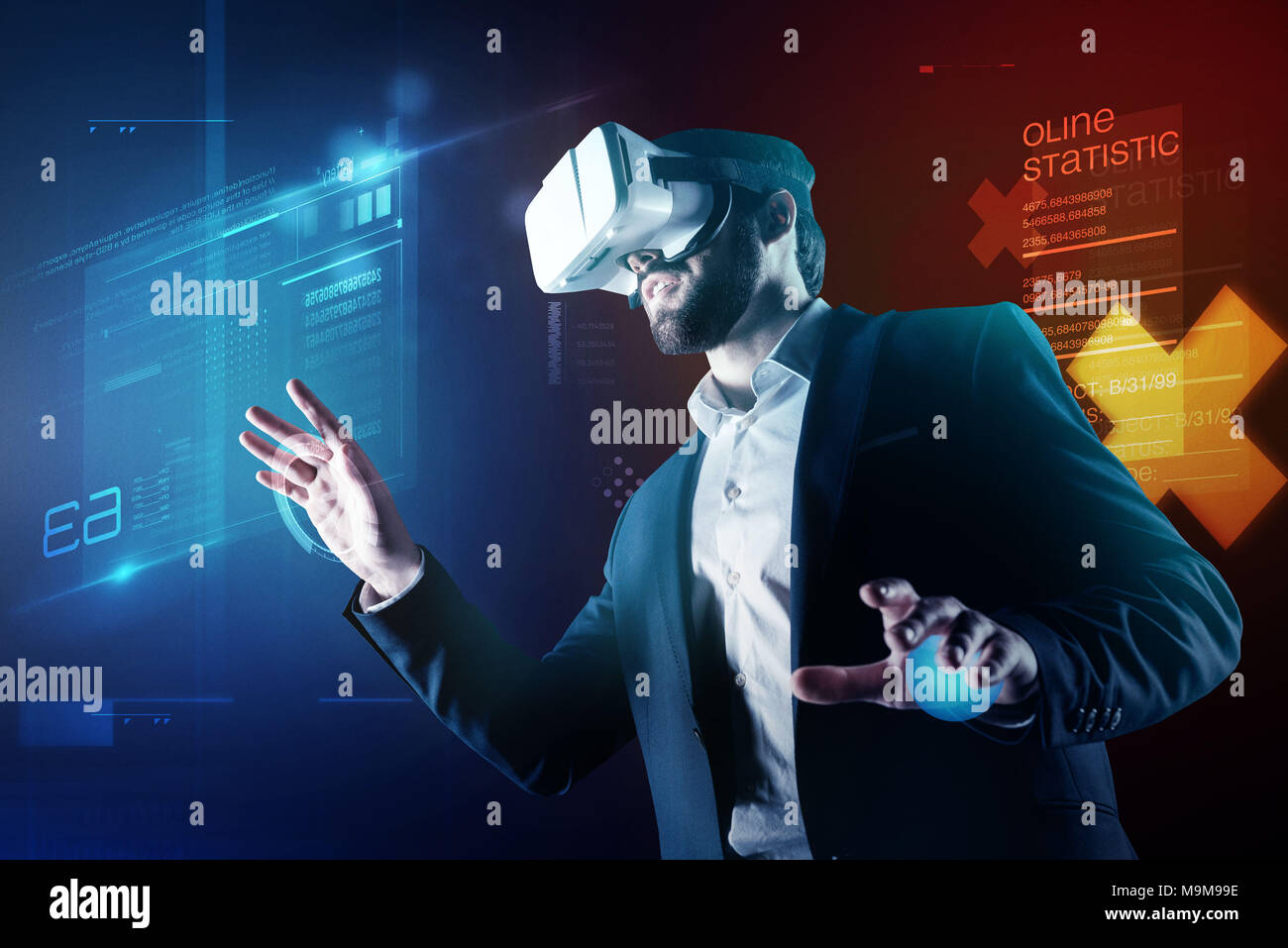 Progressive programmer wearing amazing virtual reality device while working Stock Photo