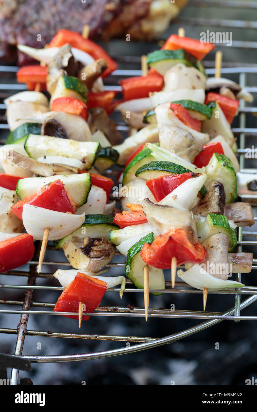 barbecue with delicious grilled meat and vegetables on grill Stock ...