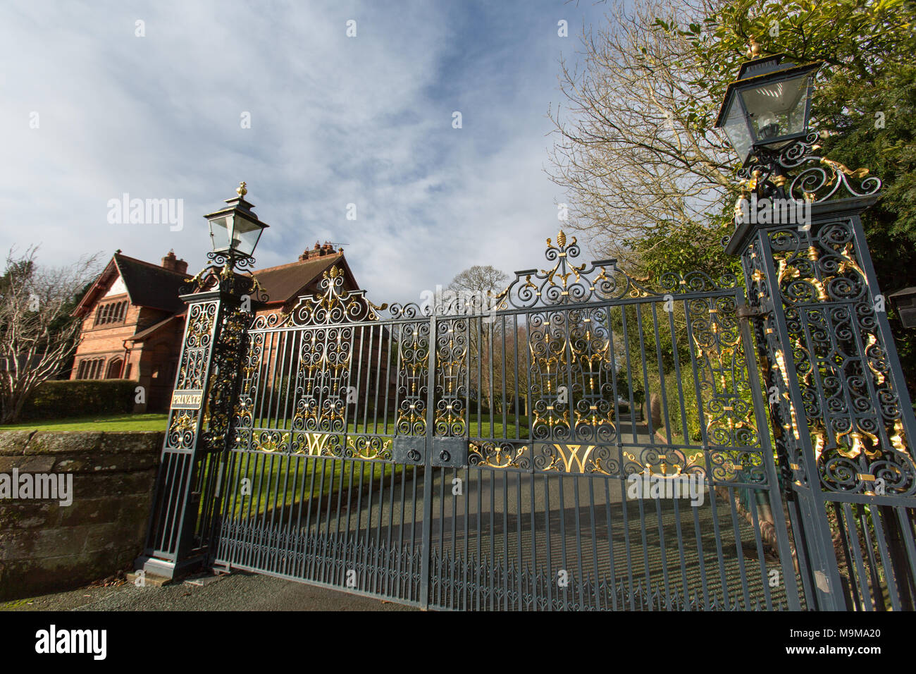 Village of Aldford, England. Picturesque view of the Aldford gated entrance to the Duke of Westminster’s, Eaton Estate. The late nineteenth century, G Stock Photo