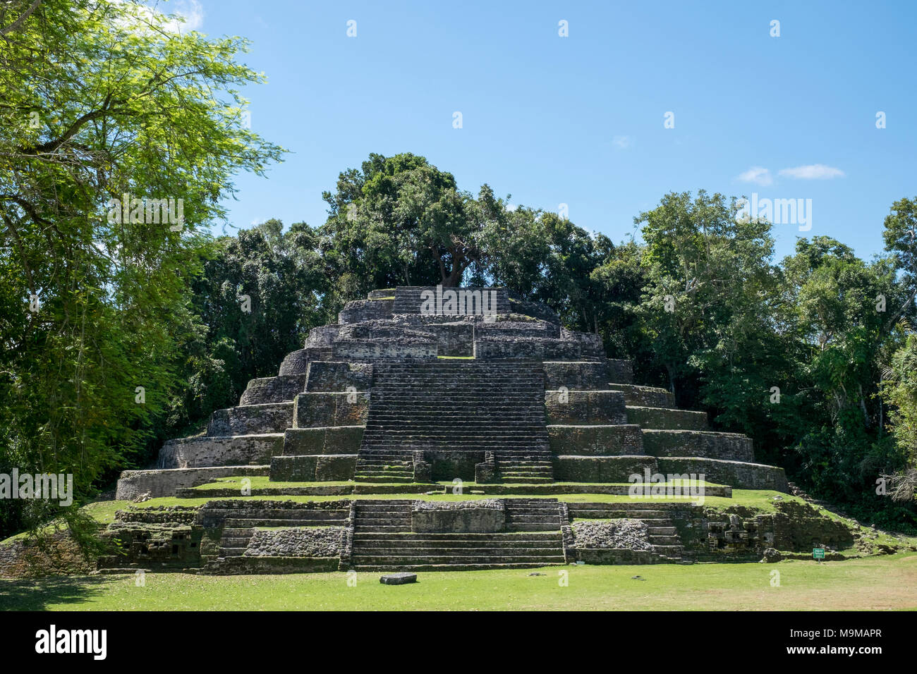 Ancient Mayan ruins and temples in the archeological site of Lamanai ...