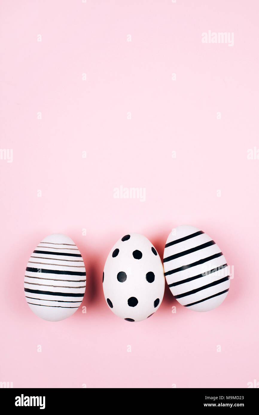 Three easter eggs on pink. Flat lay. Stock Photo