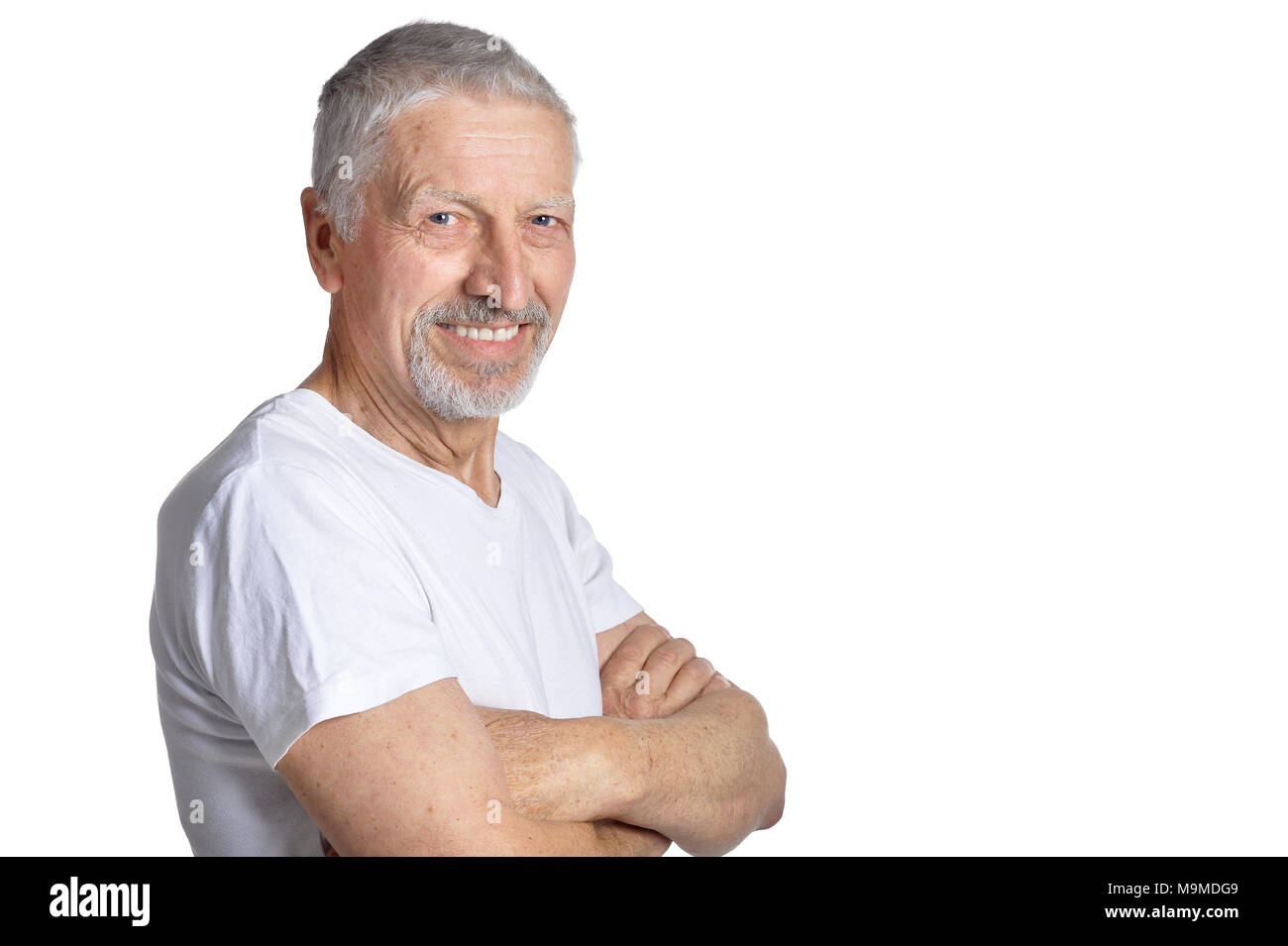 Portrait of senior man posing isolated on white background Stock Photo ...