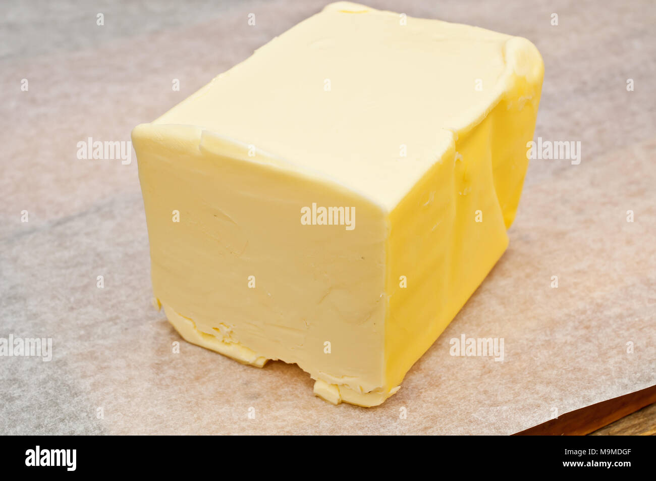 butter in parchment paper Stock Photo Alamy