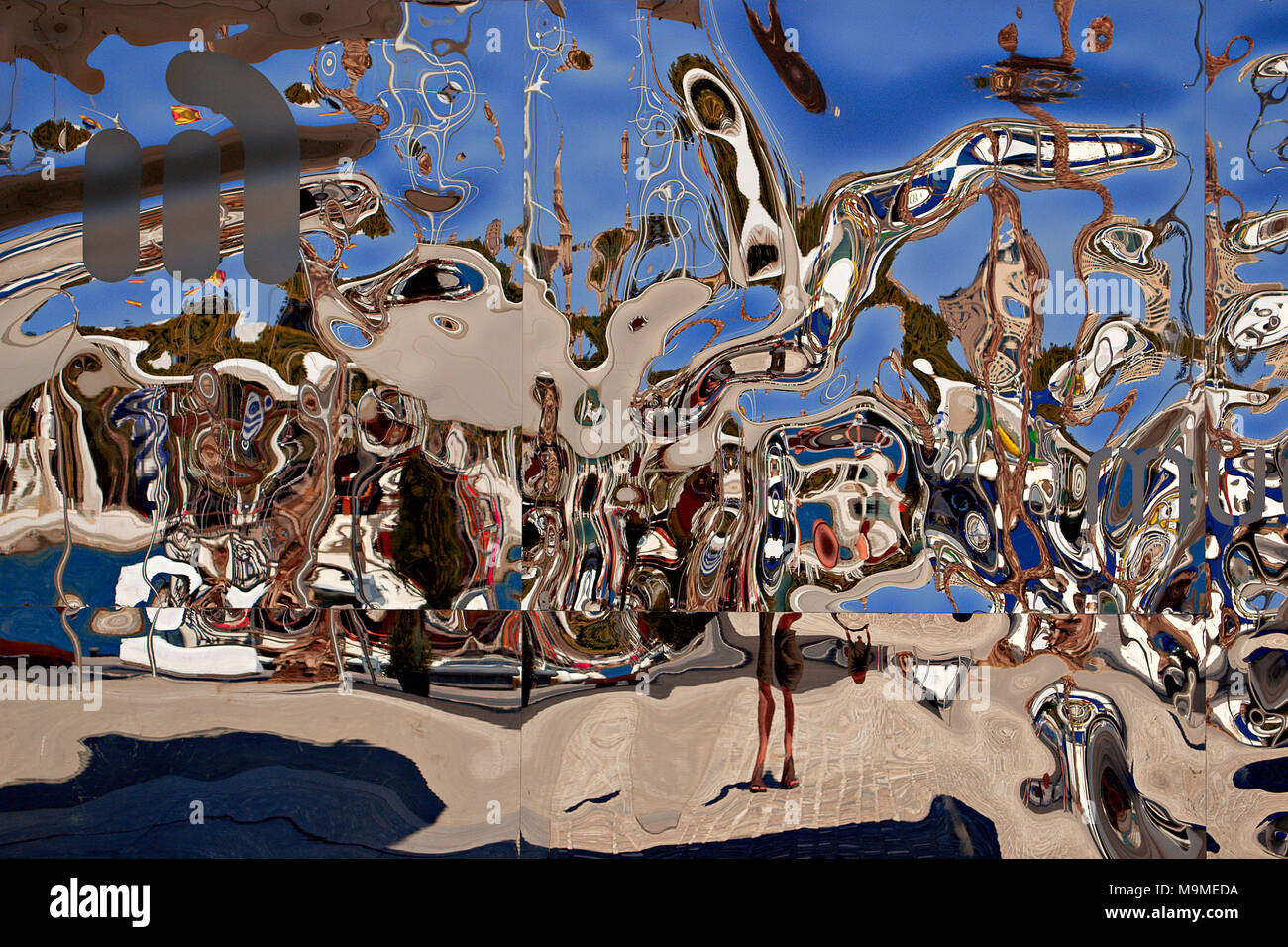 Abstract reflections in a distorting mirror, Malaga, Spain Stock Photo