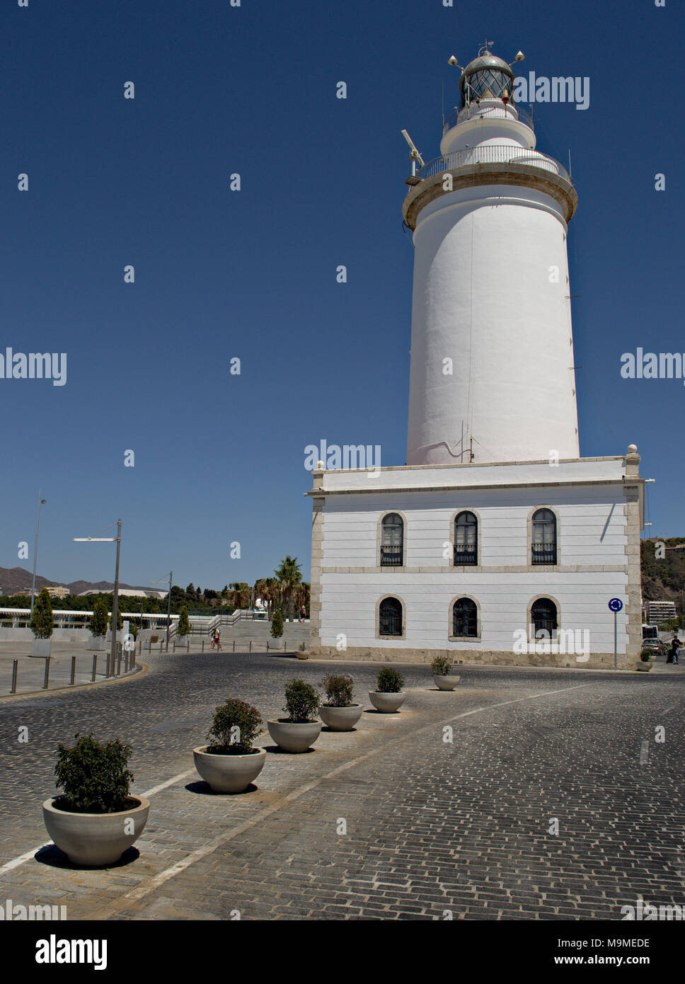 Lighthouse at Malaga port, Spain, in bright sunlight Stock Photo
