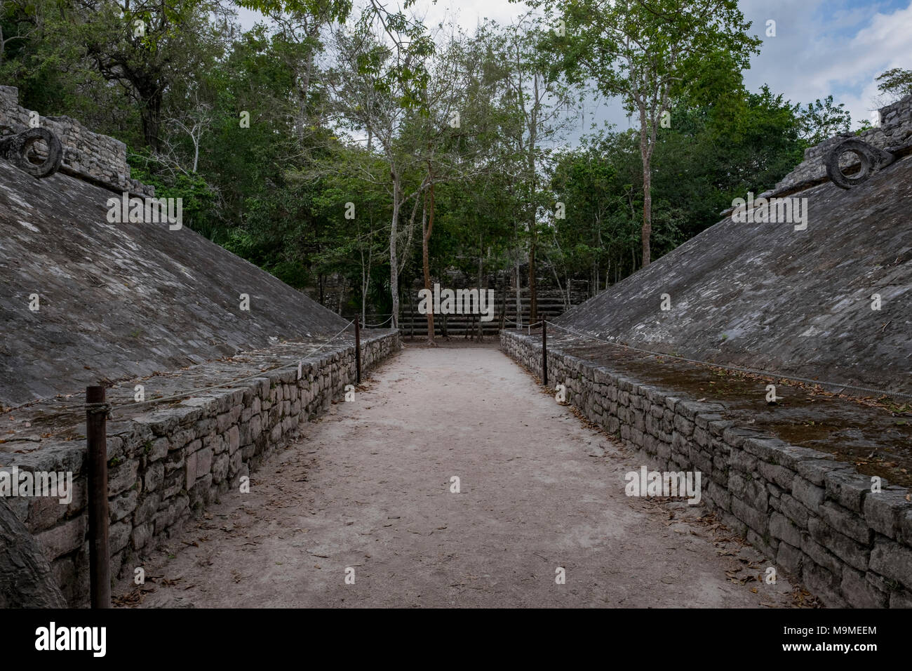 Ancient ball court ruins from the Mayan archeological site in Coba, Mexico  where ceremonial rituals were performed. Stock Photo