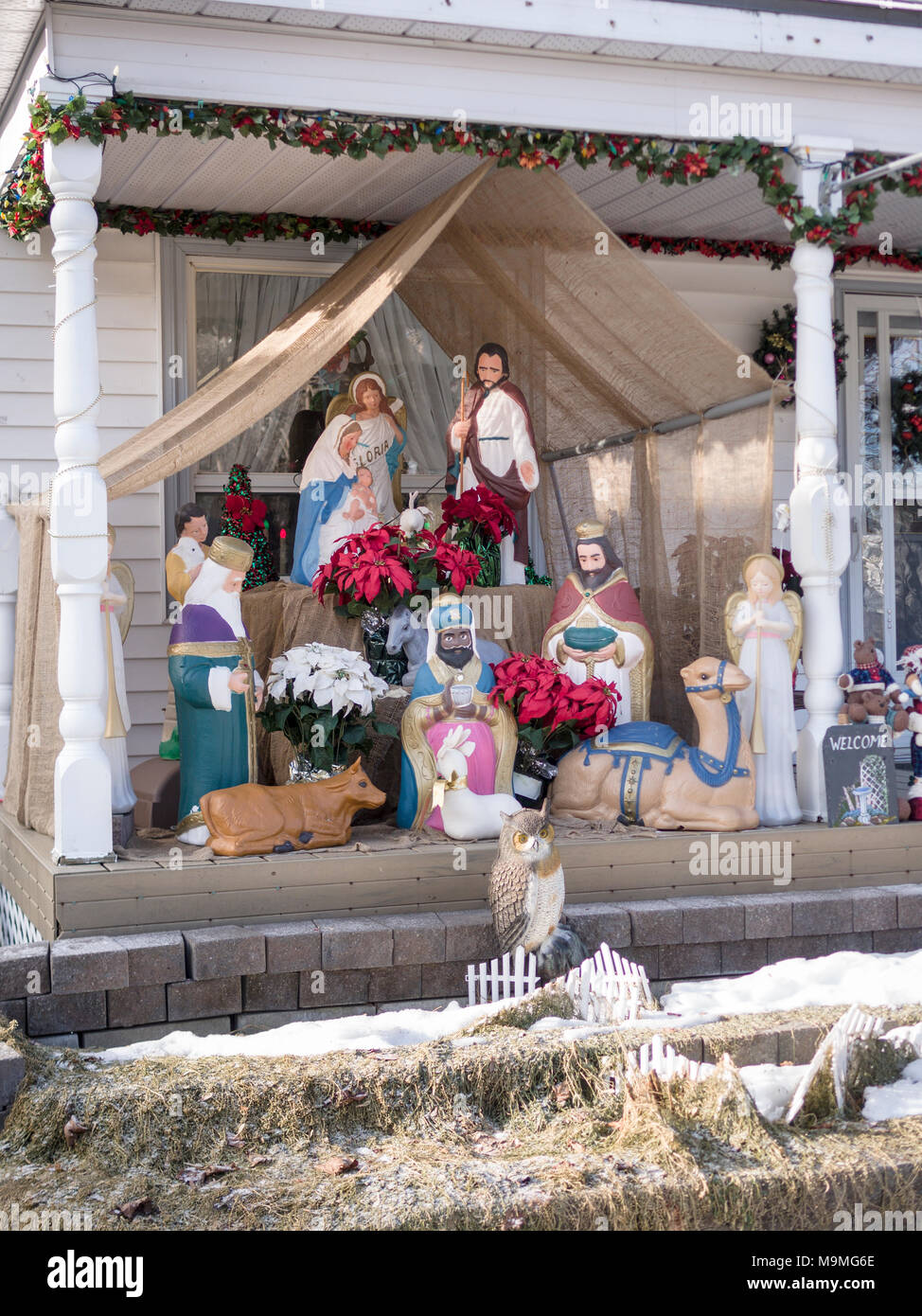 Front Porch Nativity Scene: A complex nativity scene with 3 kings, animals and other Christmas decorations cover the front portch of an Ottawa house in Little Italy. Stock Photo