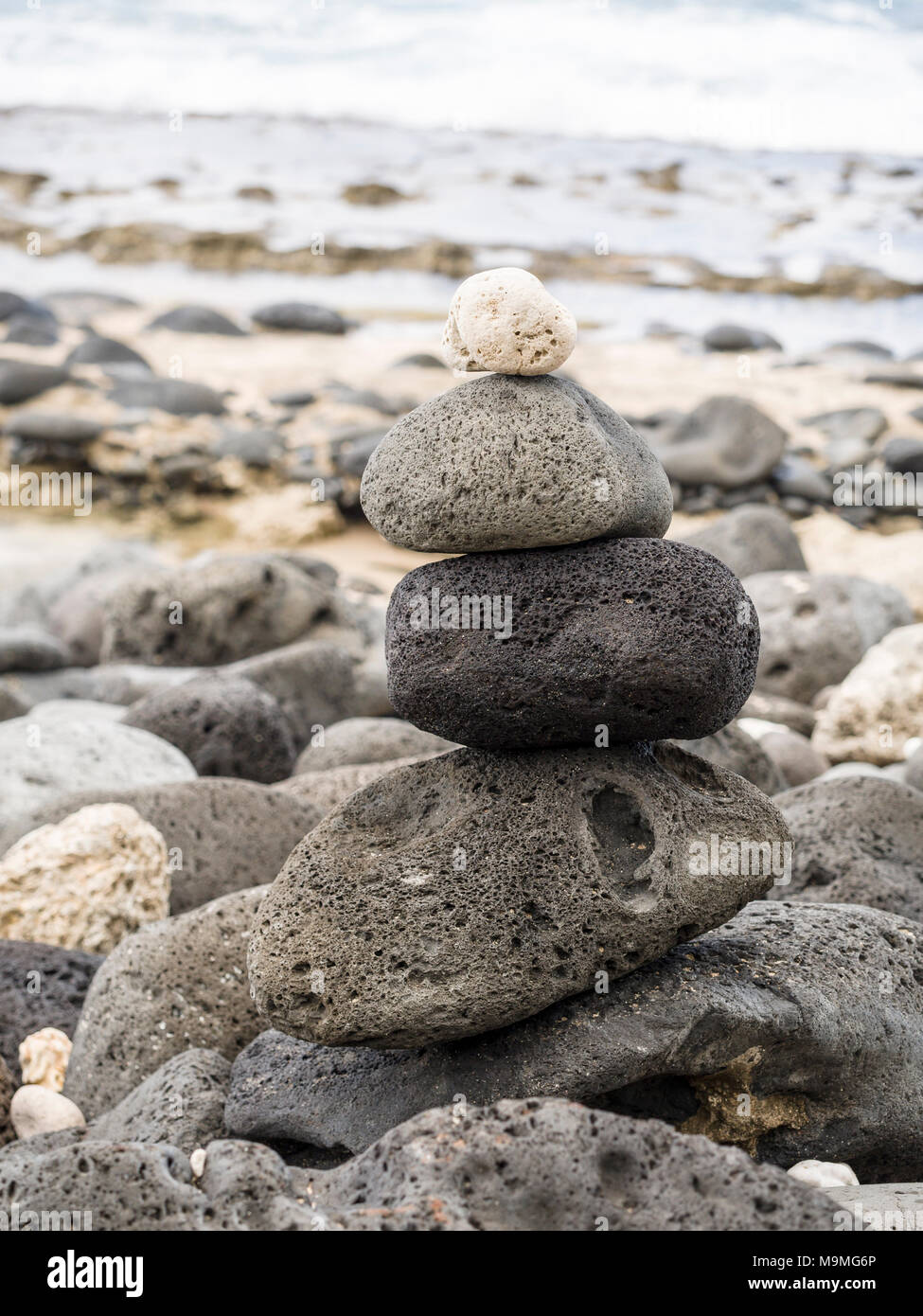 4 Piled Rocks Four Piled Stones on a Beach: Four volcanic stones of various textures ...