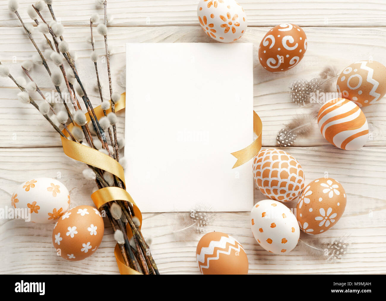 Easter background with Easter eggs and spring flowers. Top view with ...