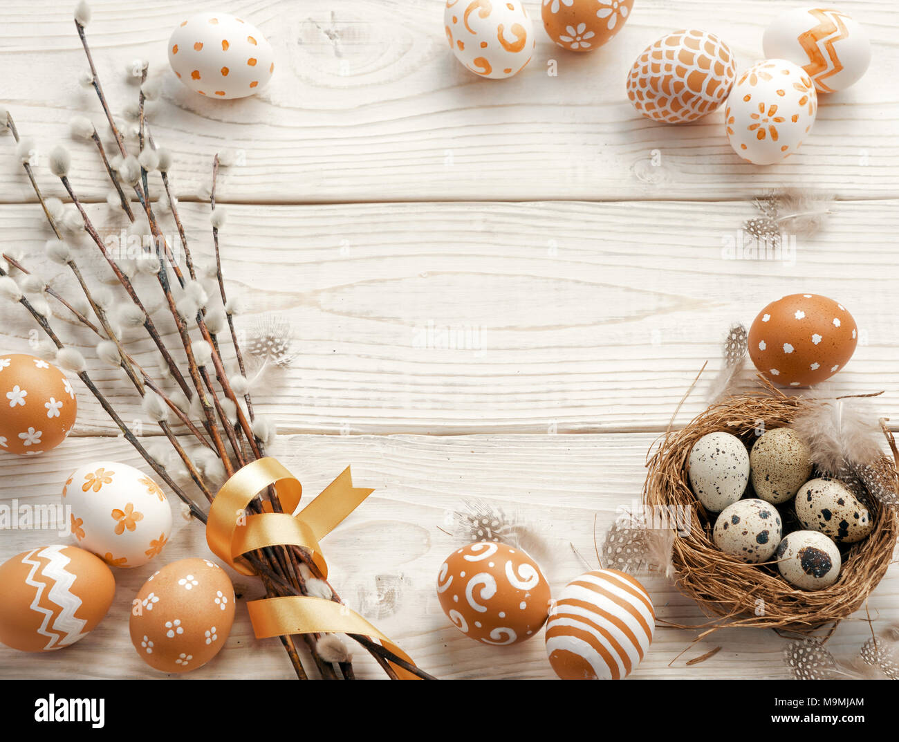 Easter background with Easter eggs and spring flowers. Top view with ...