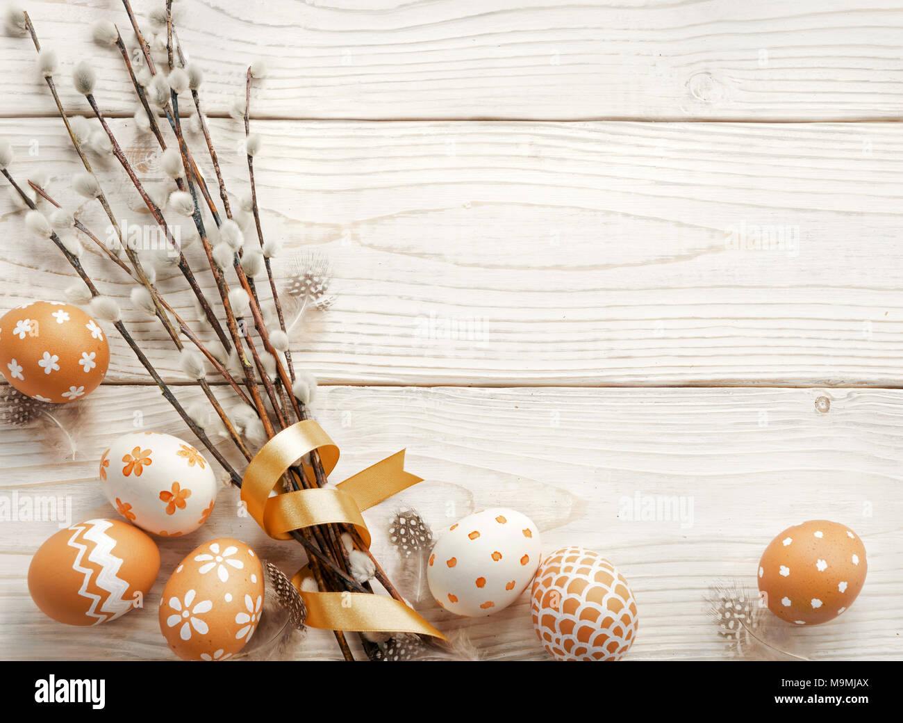 Easter background with Easter eggs and spring flowers. Top view with ...