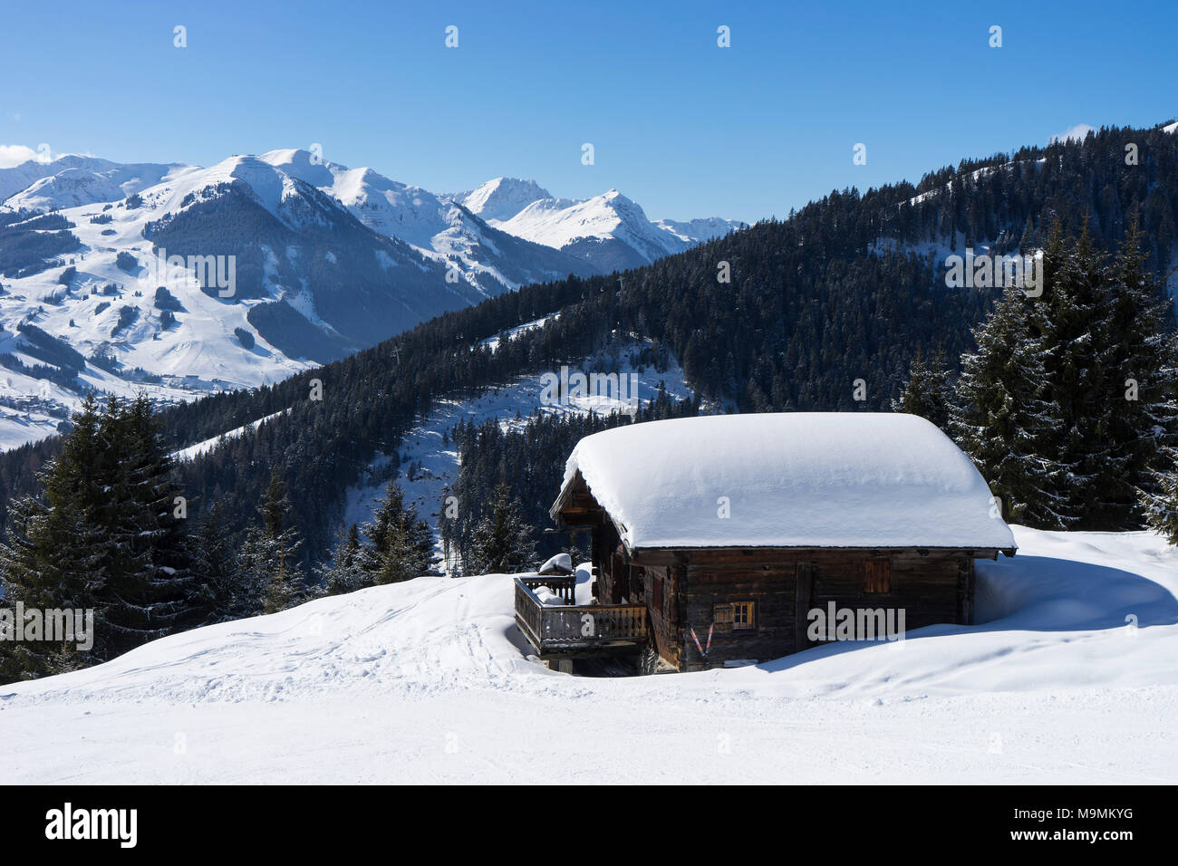 Snow-covered alpine hut Hochmaisalm, in mountain landscape, Pinzgau, Salzburger Land, Austria Stock Photo