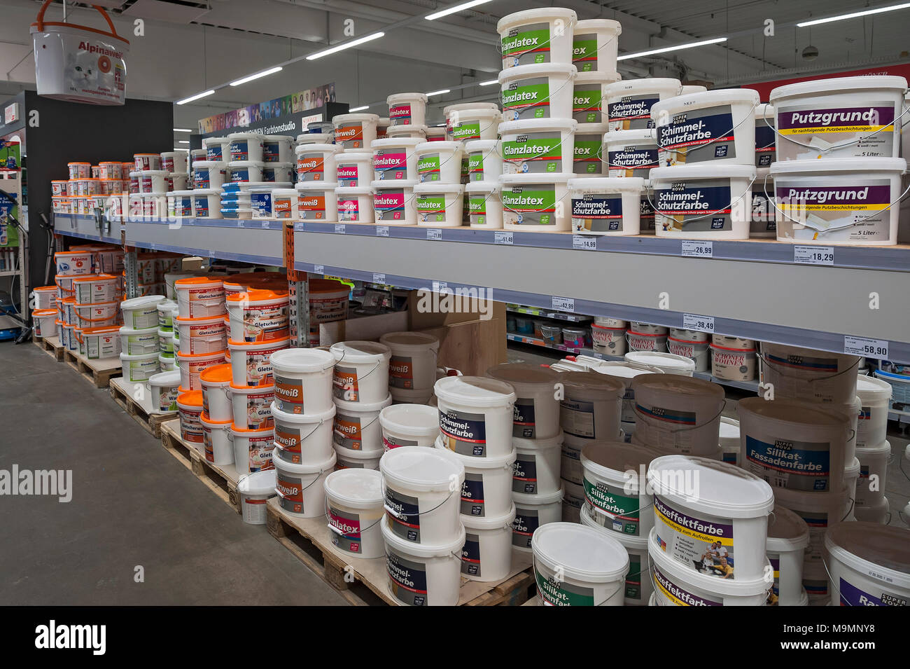 Accessories for painters, Shelf with wall paints, hardware store