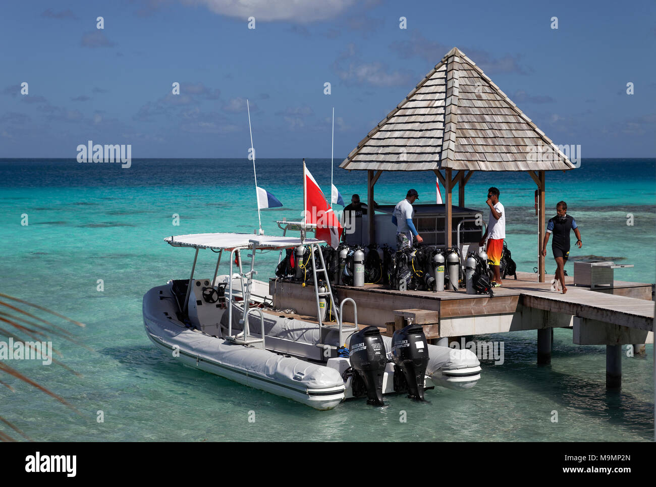 Top Dive Center, Divers preparing to dive, Inflatable Boat at the pier, Diving equipment, Sea, Pacific Ocean Stock Photo