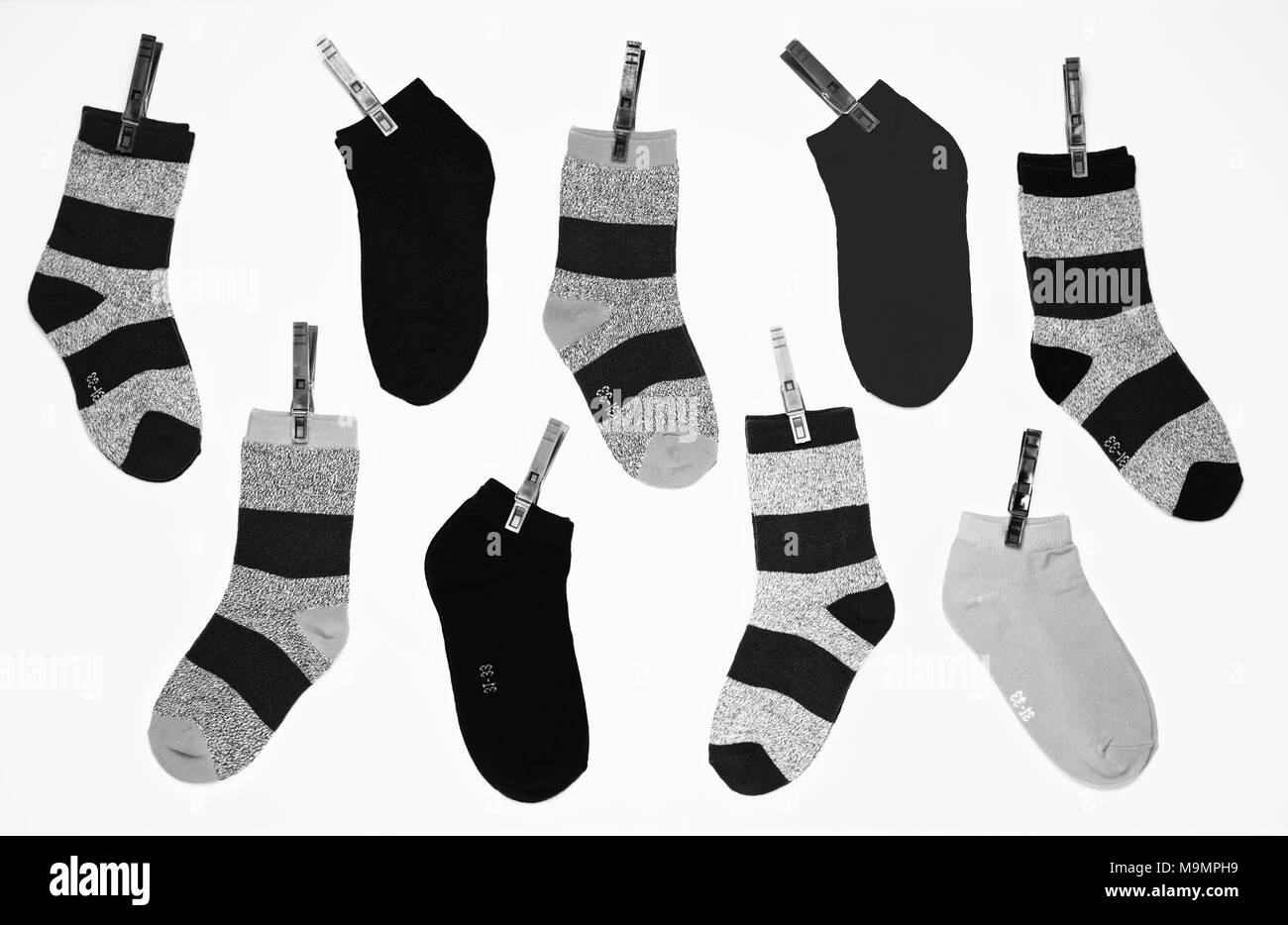 Black and white young boy socks pattern on white background Stock Photo