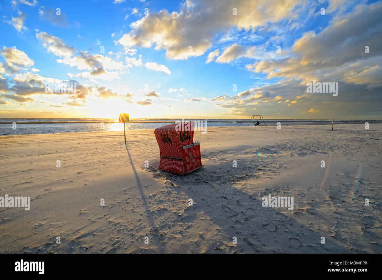Beach chair in the back light at the beach of Langeoog, Ostfriesische Insel, Germany Stock Photo