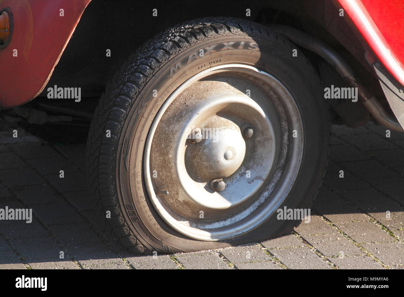 Flat tire on vintage car, Citroen 2CV Ente, Germany Stock Photo