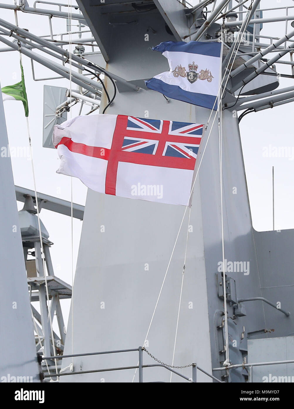 The Ensign is lowered at the decommissioning ceremony for HMS Ocean at HMNB Devonport in Plymouth. Stock Photo