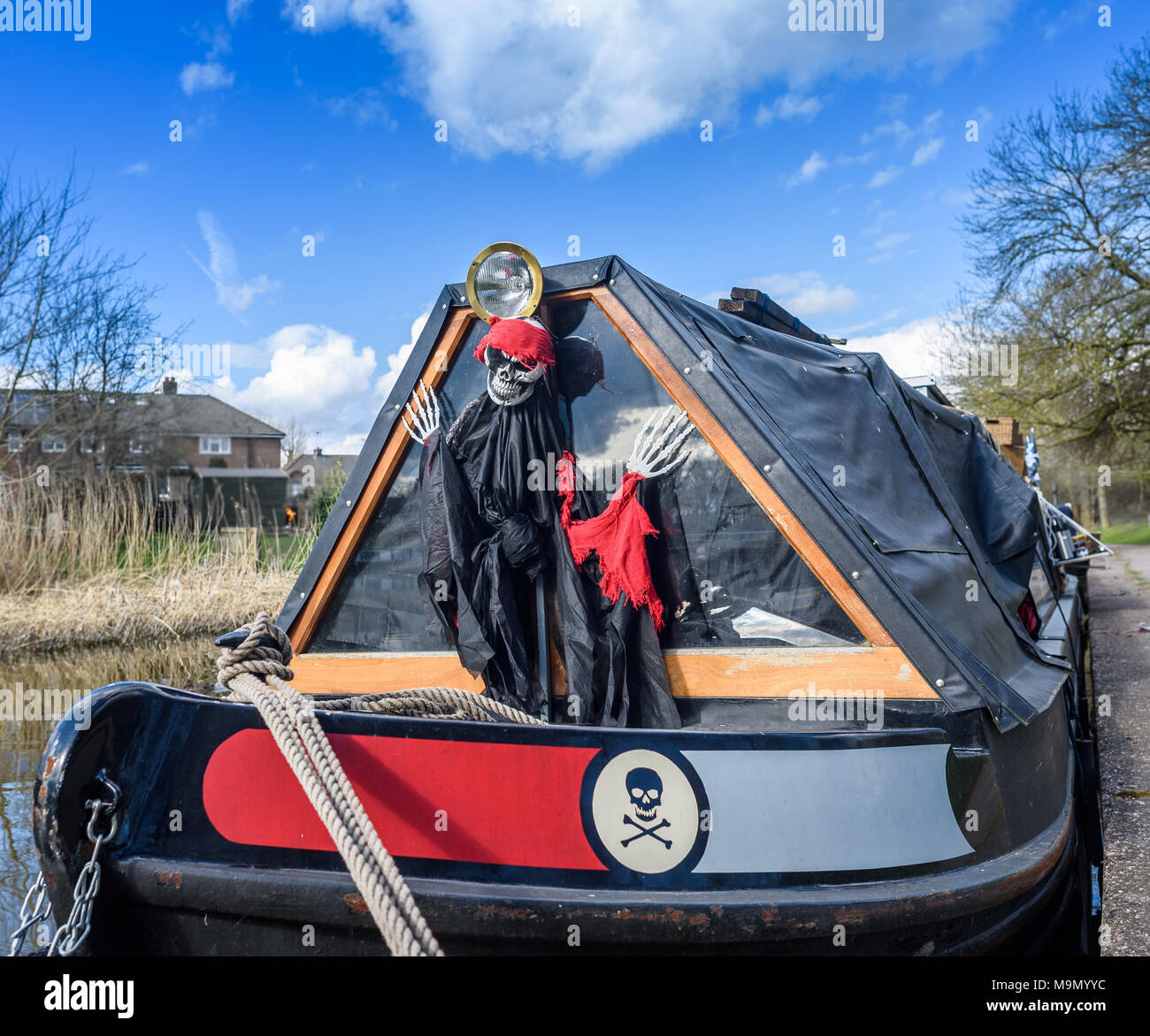 A narrowboat decorated with a spooky skeleton. Stock Photo