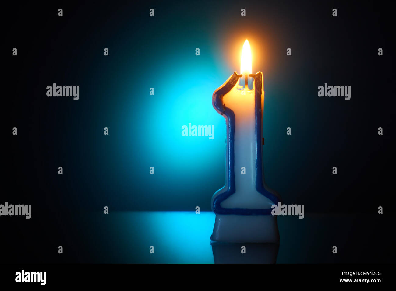 Number One - Burning birthday candle Stock Photo