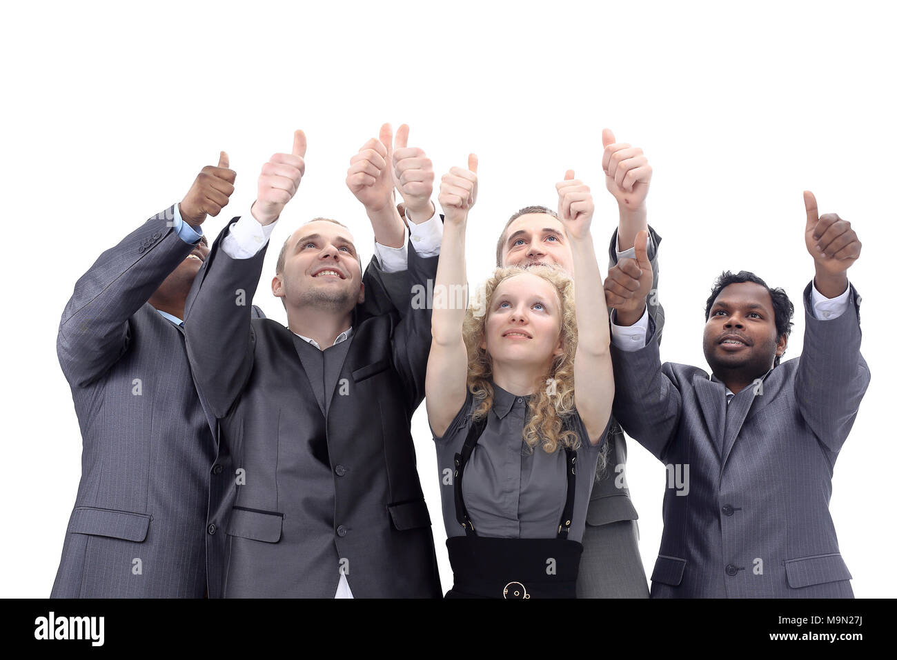 closeup.international business team showing thumbs up Stock Photo - Alamy