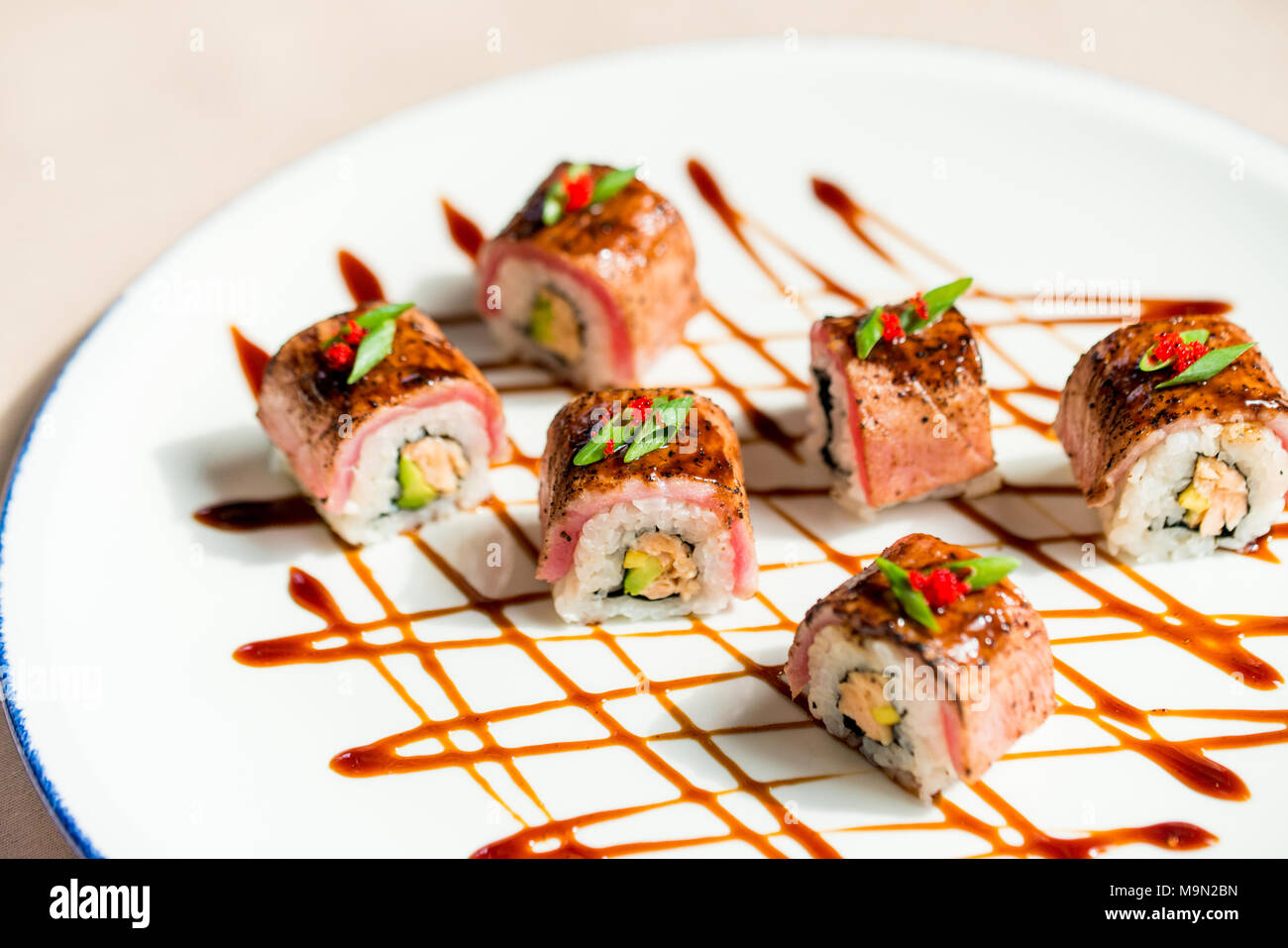 Close Up Delicious Sushi Rolls With Fish Caviar Served On Plate