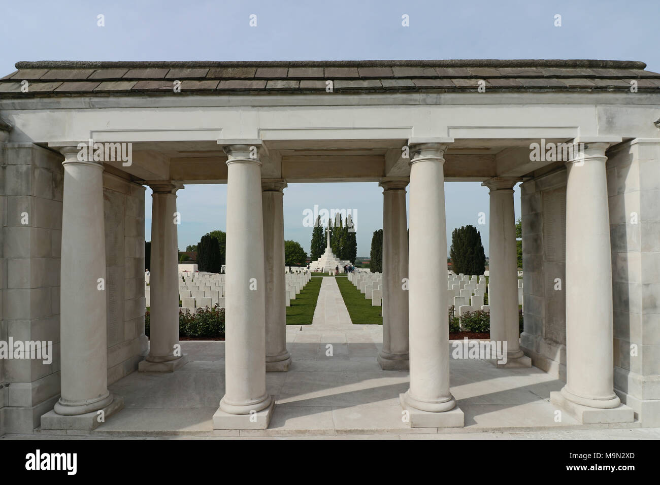 Tyne Cot Commonwealth War Graves Cemetery Archway and Columns with Cross of Sacrifice in Distance Stock Photo