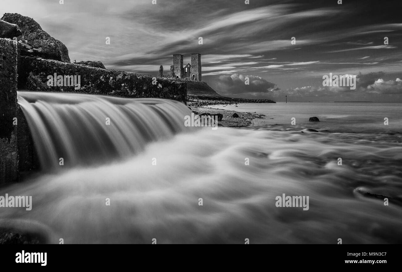 A photograph taken by the old River Wantsum channel outlet looking towards Reculver Towers in Kent. Stock Photo