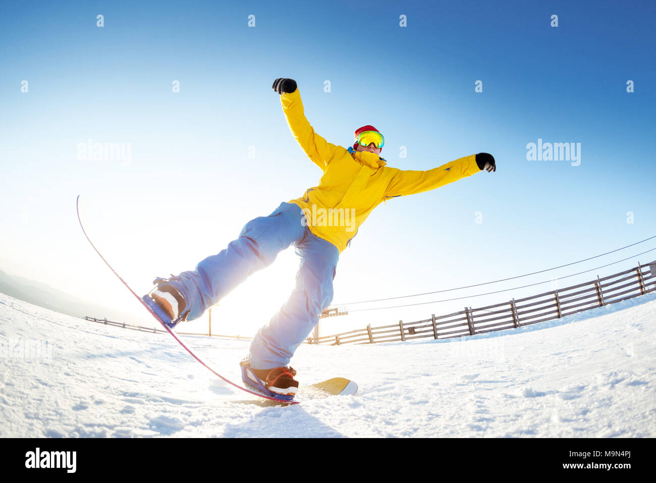 Snowboarder having fun jumps ski resort Stock Photo