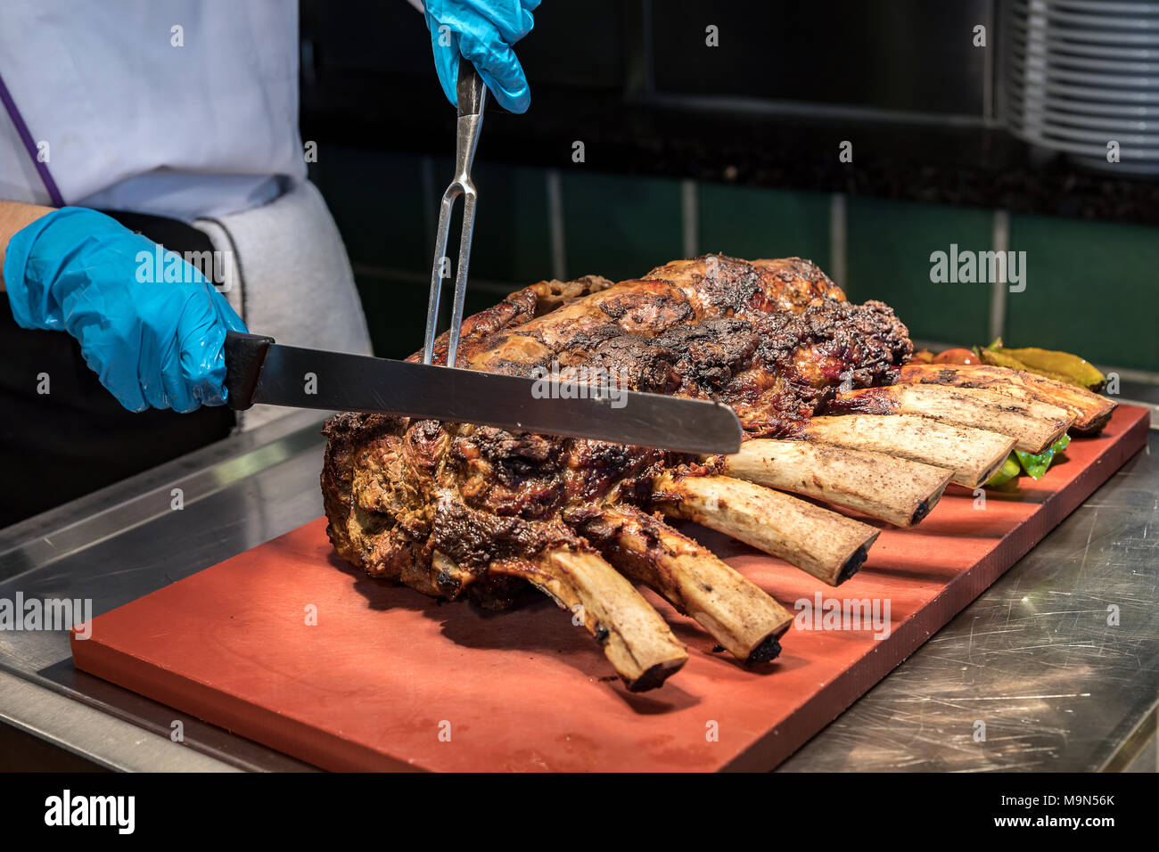 Chef Carving prime rib of roast Wagyu beef Stock Photo Alamy
