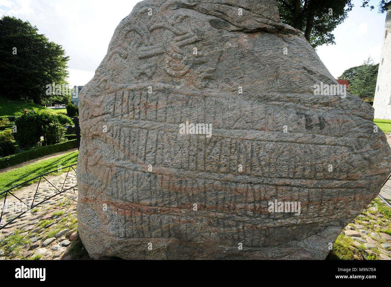 Massive carved runestones Jellingstenene (Jelling stones) from X century, king Harald Bluetooth Gormsson's runestone from 983 in memory of his parents