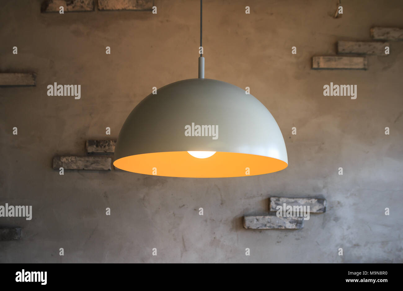 pendant lamp on gray wall background Stock Photo
