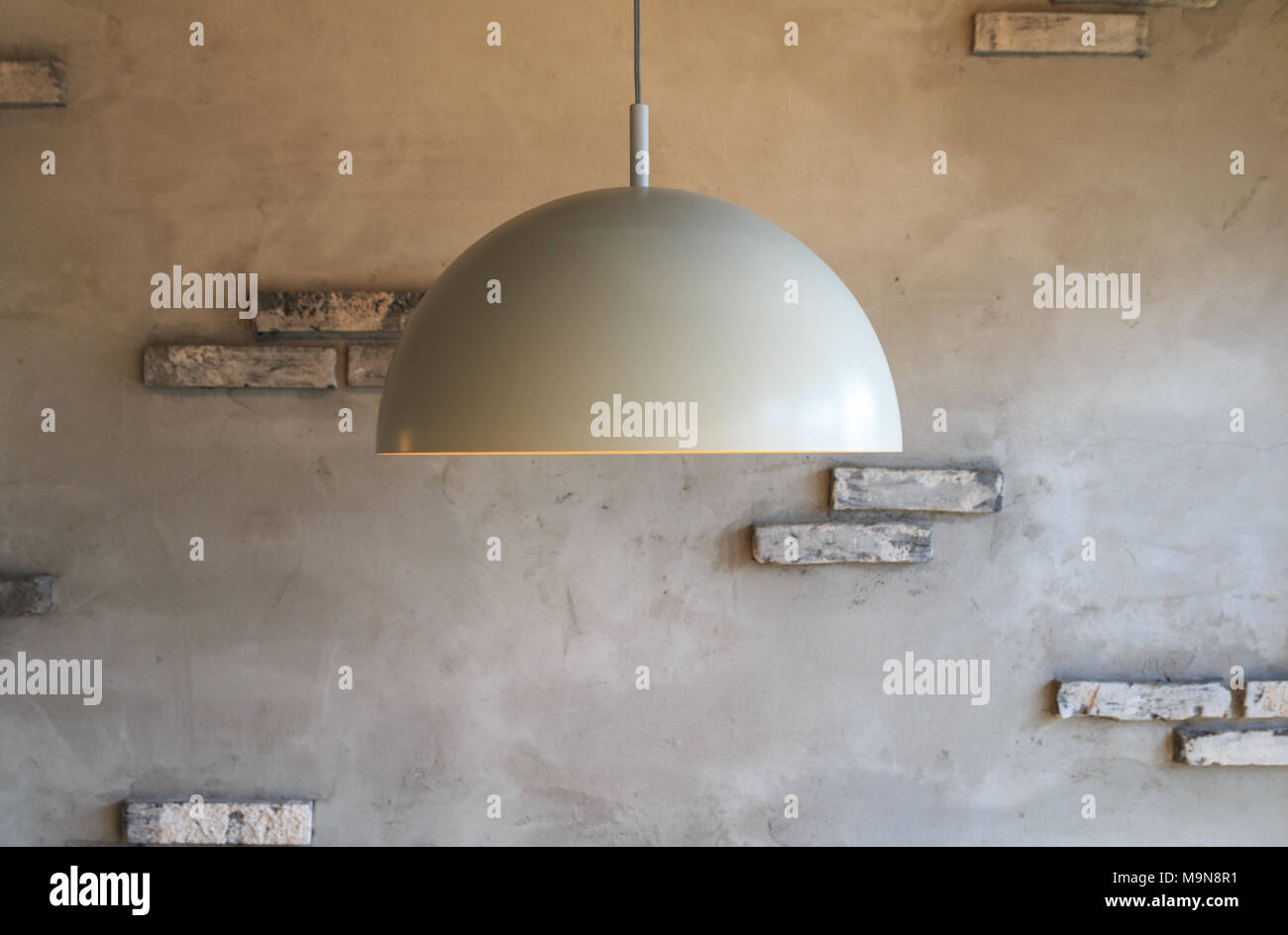 pendant lamp on gray wall background Stock Photo