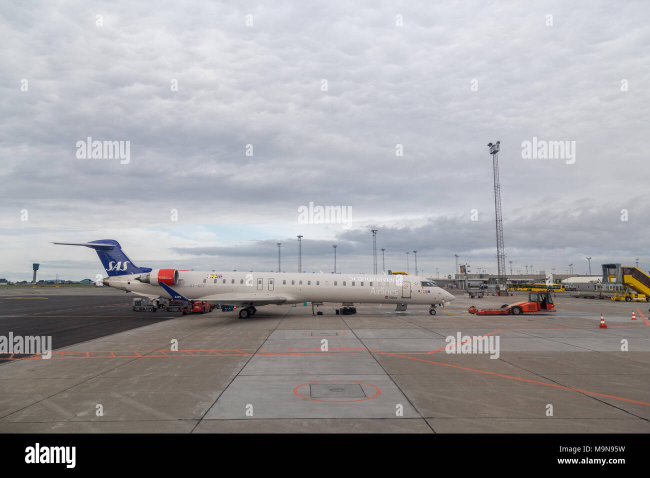 Airport pushback truck with aircraft Stock Photo