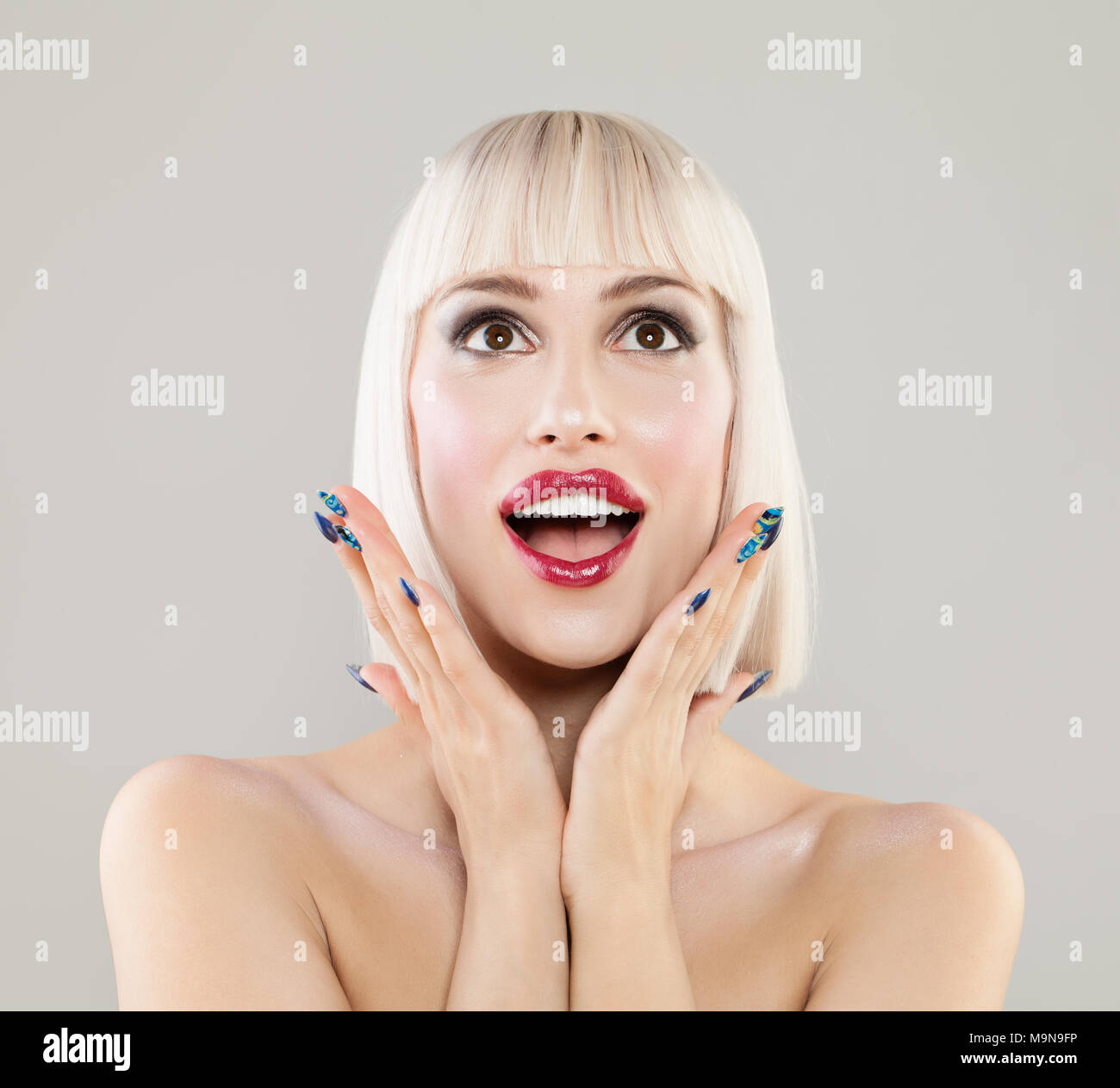 Surprised happy woman with Blonde Hair Portrait Stock Photo - Alamy