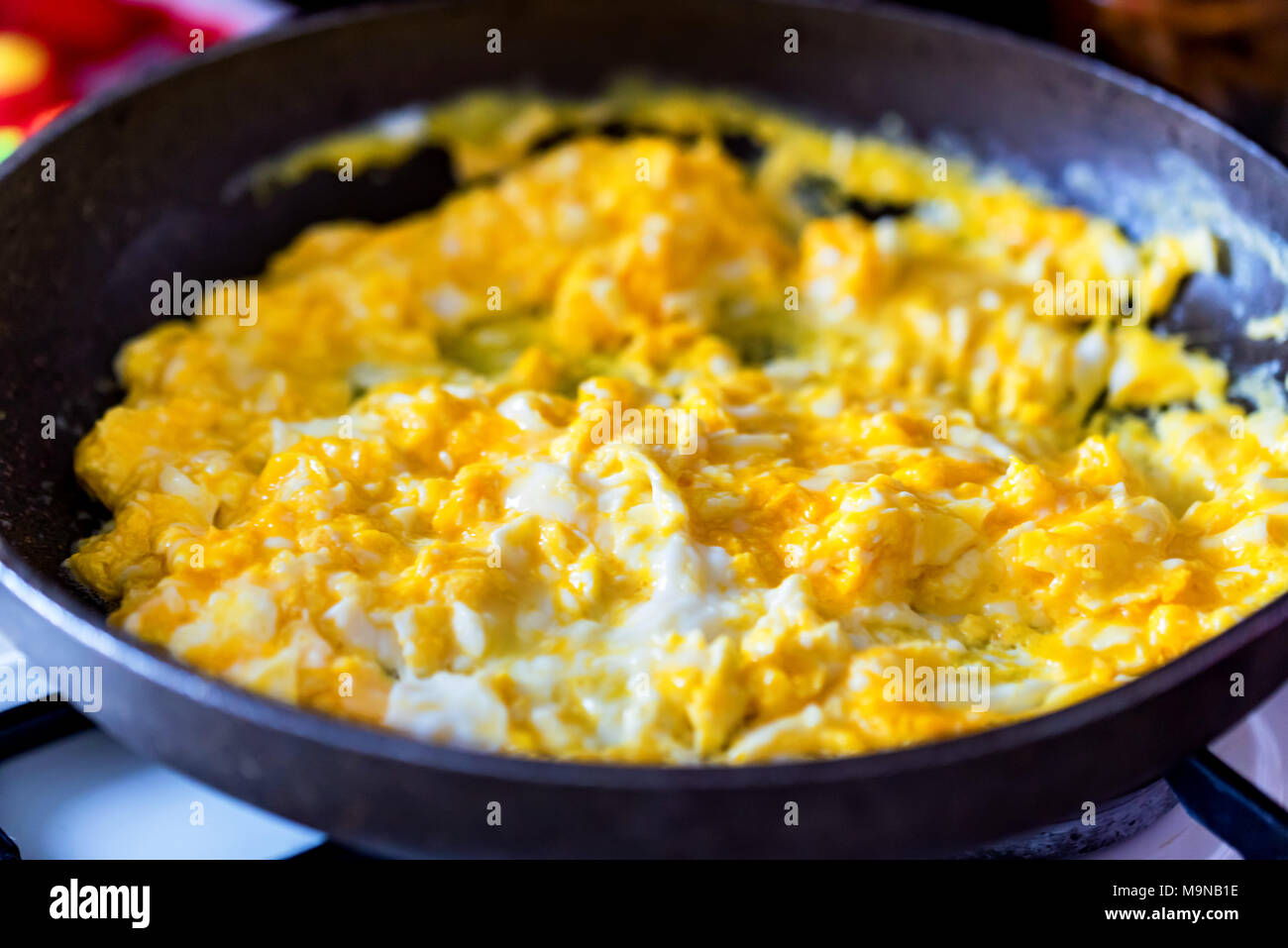 Scrambled egg in frying pan close Stock Photo Alamy