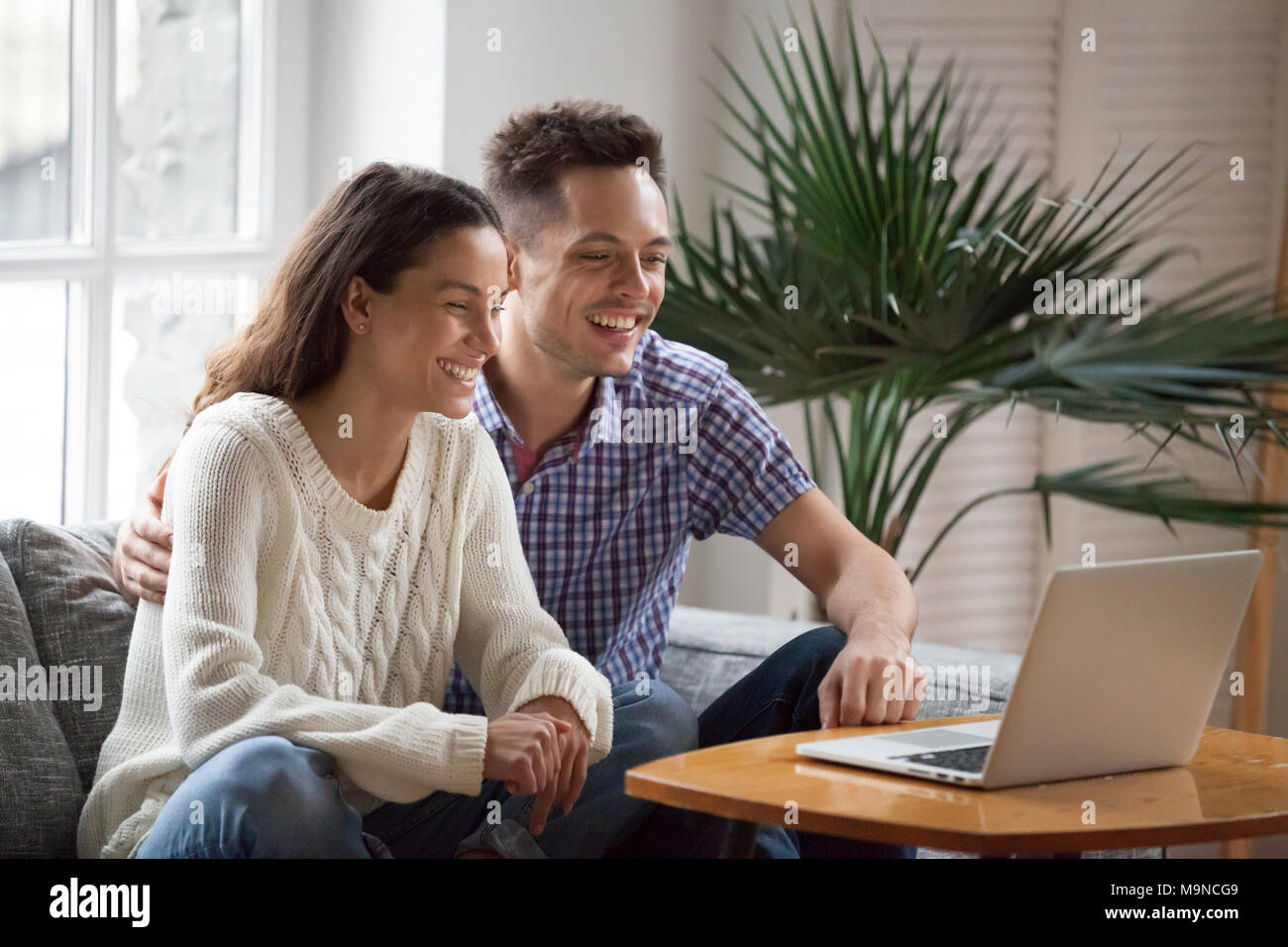 Happy young couple laughing watching funny video or comedy movie online, cheerful man and woman having fun enjoying videocall looking at laptop screen Stock Photo - Alamy Happy young couple laughing watching funny video or comedy movie online, cheerful man and woman having fun enjoying videocall looking at laptop screen Stock Photo - Alamy