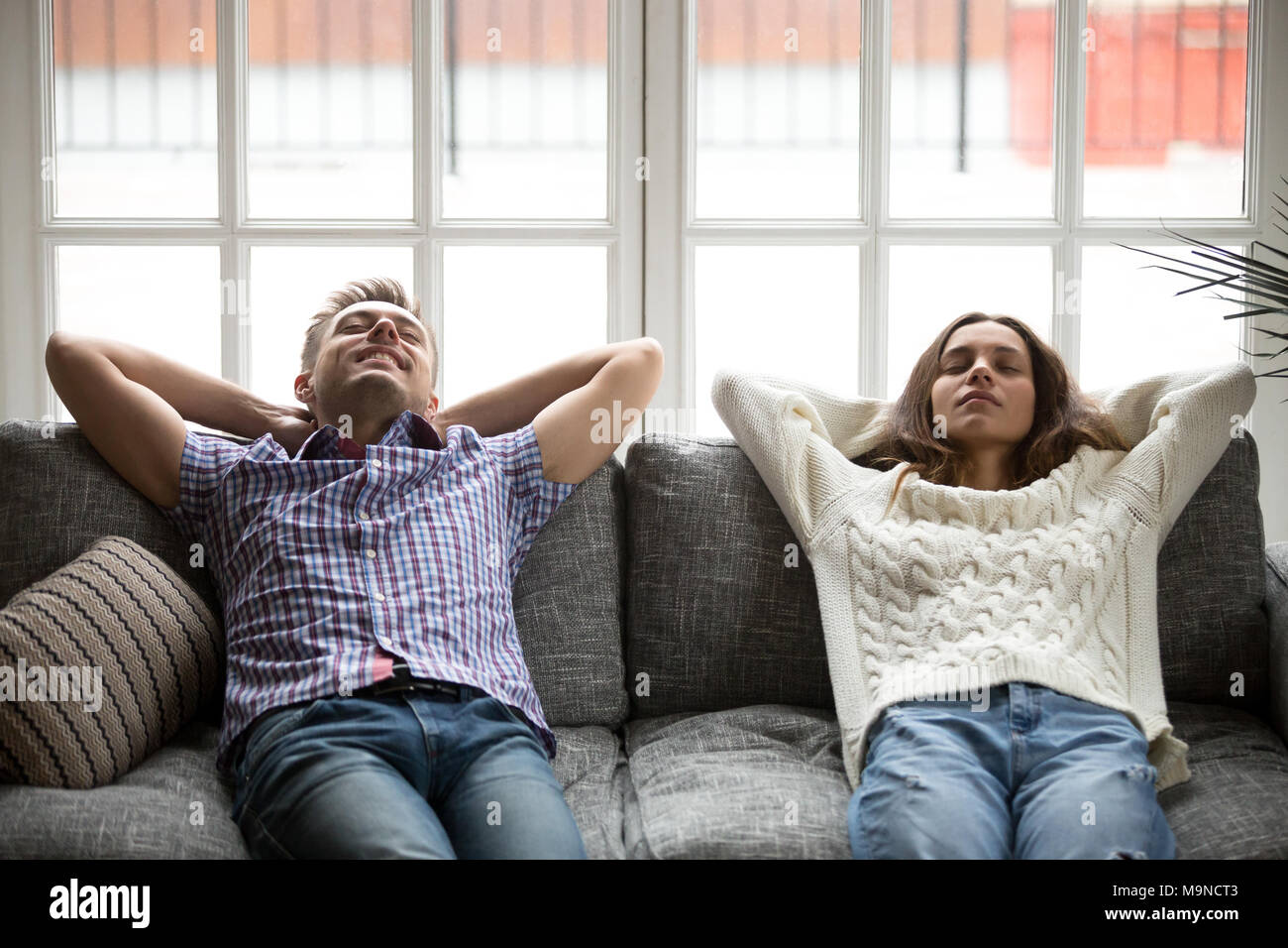 Young couple sleep on couch hires stock photography and images Alamy