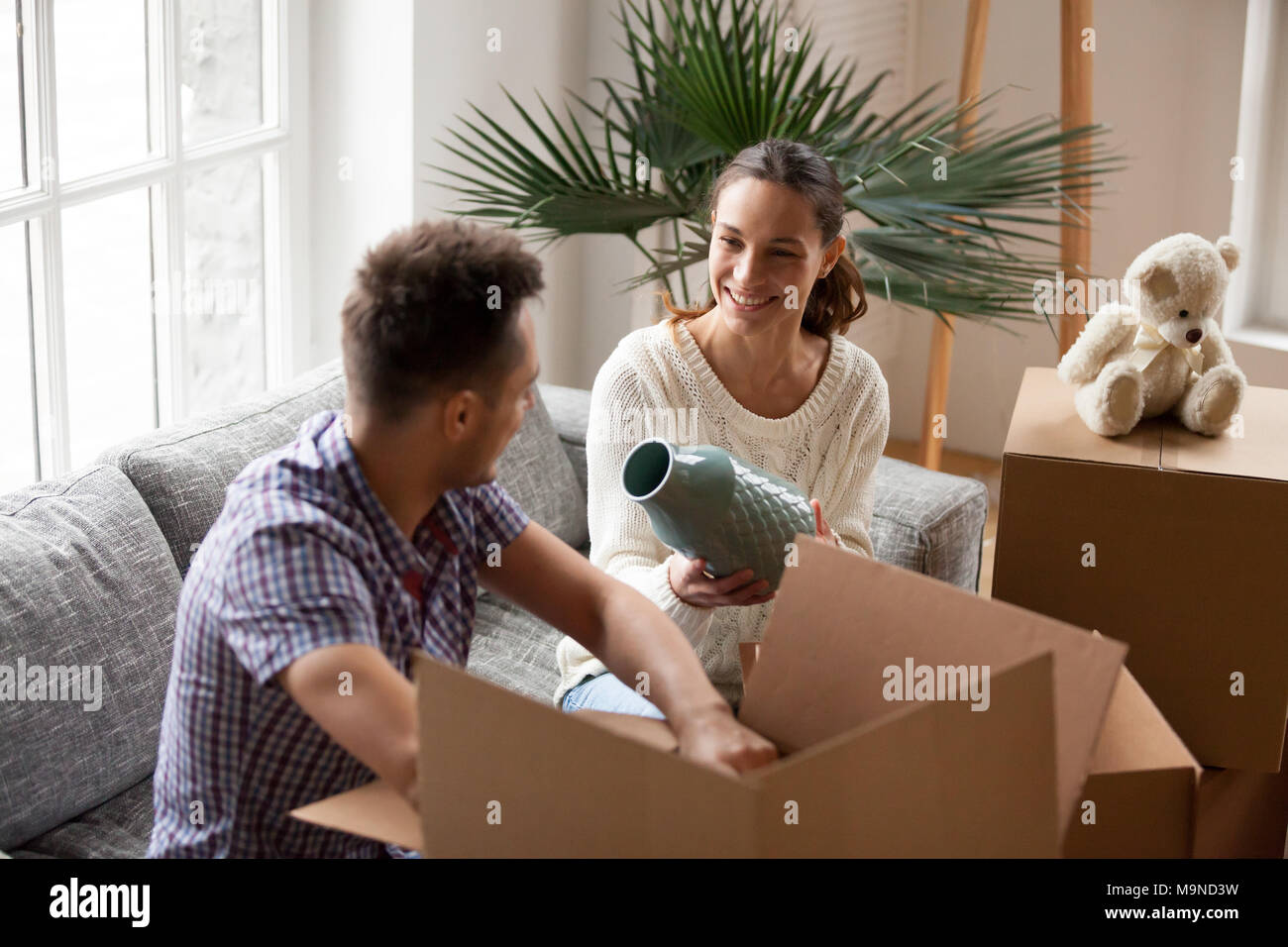 Couple packing cardboard boxes hires stock photography and images Alamy