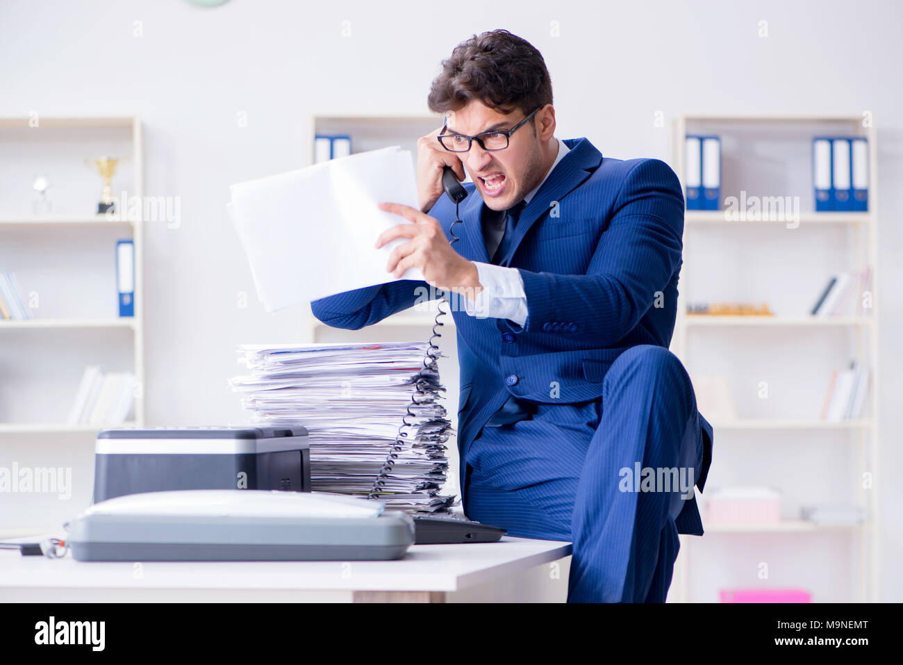 Businessman making copies in copying machine Stock Photo - Alamy