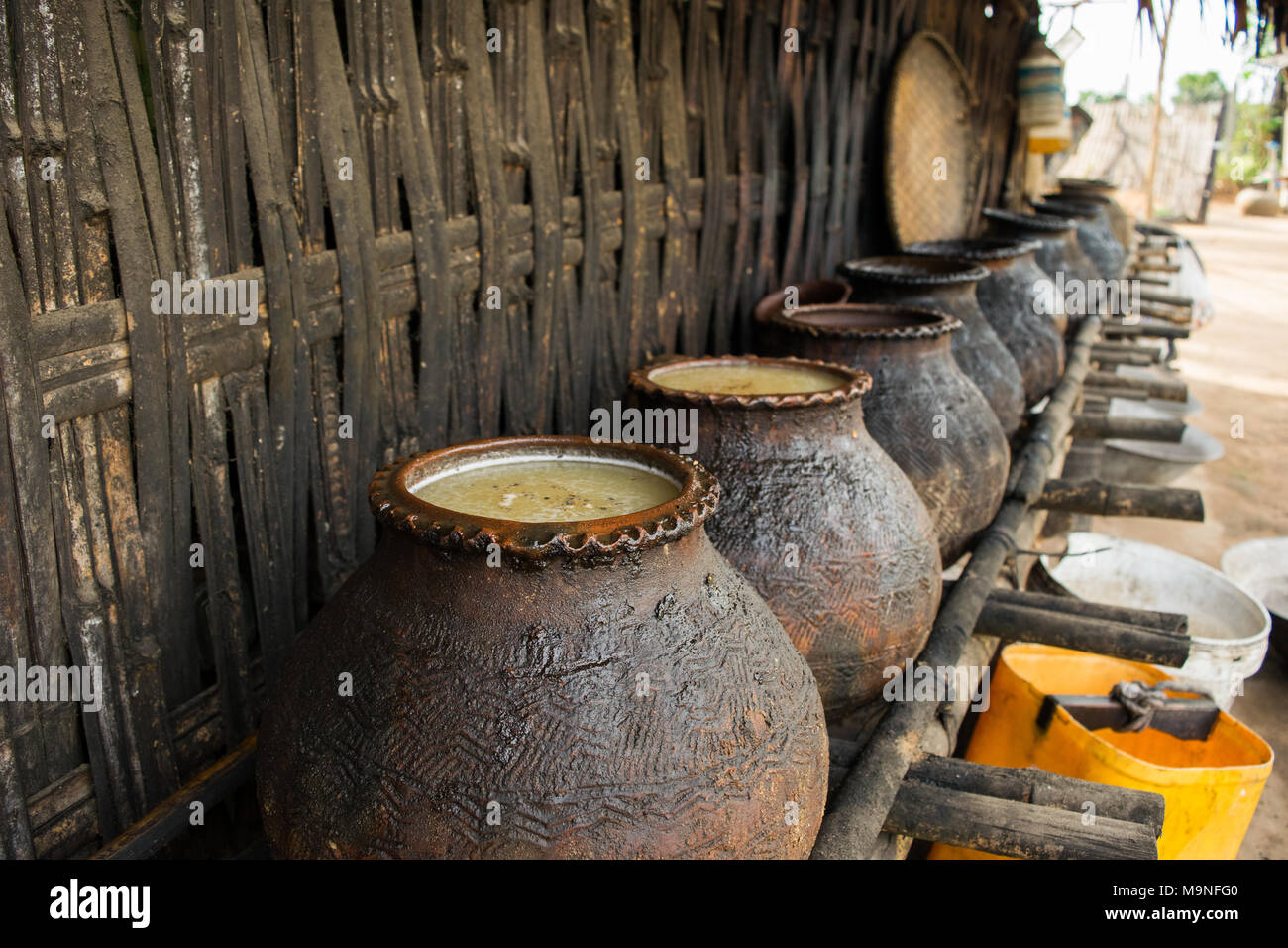 Clay pots for fermentation and distillation of palm juice and sap for local palm alcohol, palm wine, toddy wine, htan ye, near Bagan, Myanmar, Burma Stock Photo