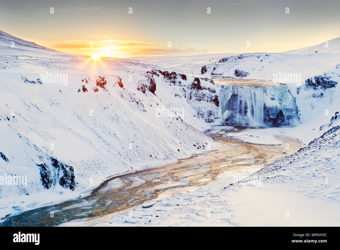 Sunrise Over Frozen Waterfall In Iceland Taken On The Games Of