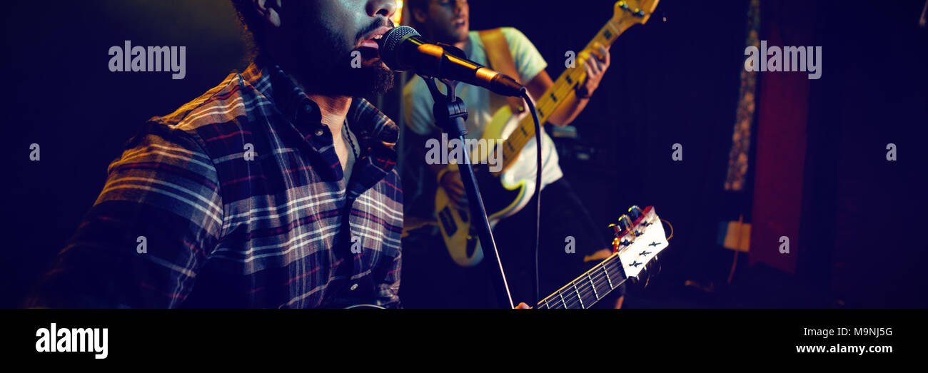 Young male microphone stage hi-res stock photography and images - Alamy