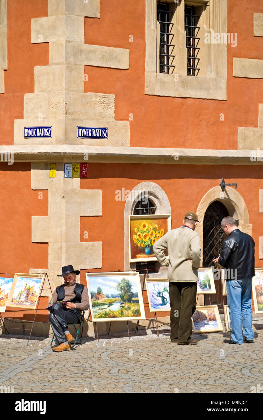 Wroclaw, Silesia, Poland. Artist selling paintings in front of the Town Hall, Rynek Ratusz Stock Photo
